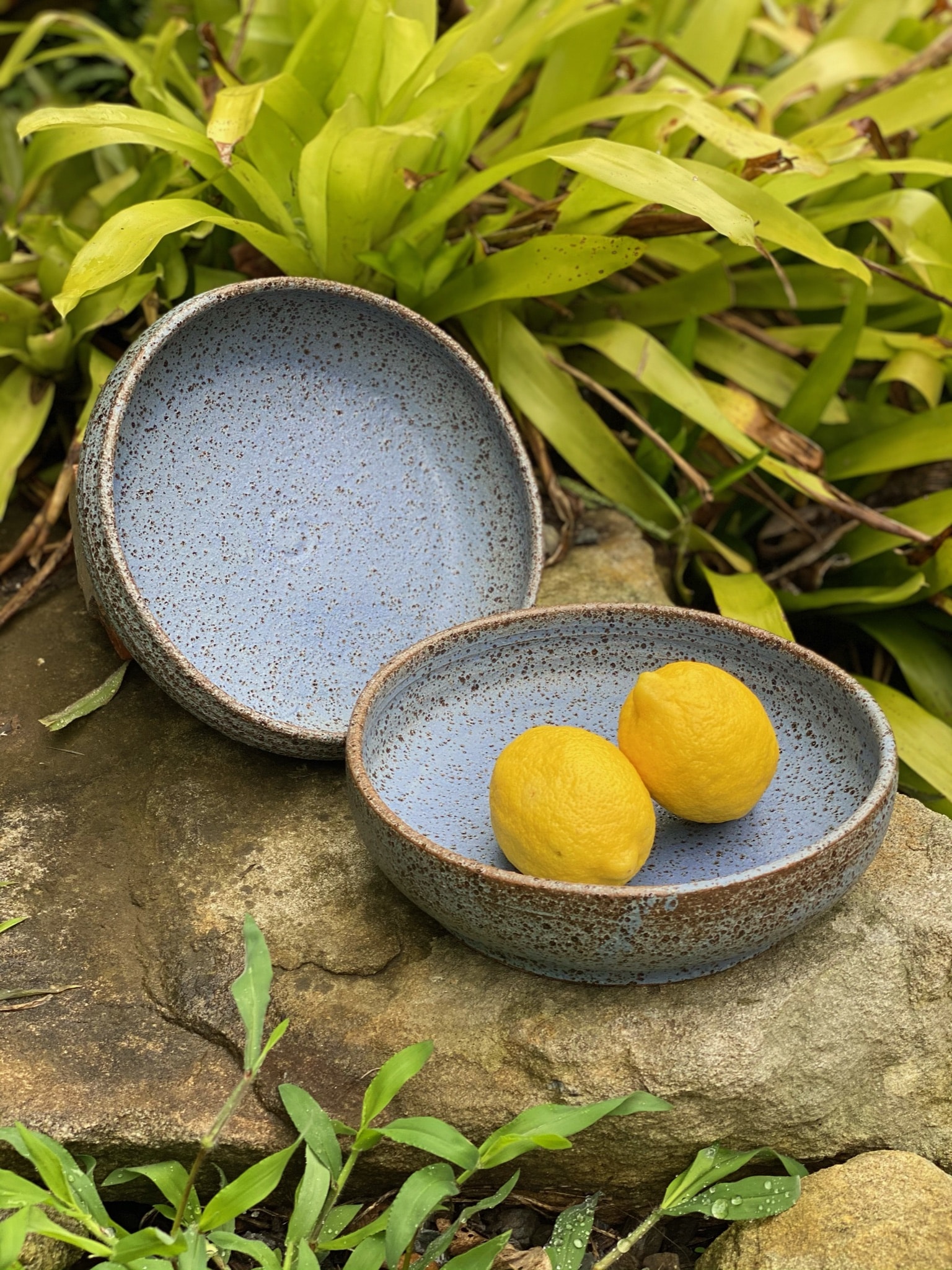 Large pasta bowls in speckled clay with blue matt glaze